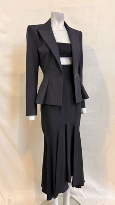 an image of a woman ' s suit and skirt on a mannequin