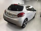 a picture of a white car in a garage