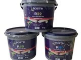 three buckets of bostik r25 paint sitting on top of each other