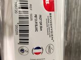 someone is holding a toothbrush in a plastic bag with a barcode on it