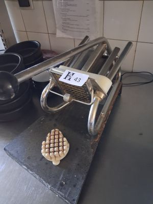a toaster that is sitting on a counter next to a pan