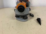 an orange and gray tripod with a plastic case on top of it