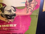 a poster with a picture of a man and a dog on it