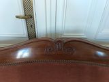a bed with a wooden headboard and a wooden foot board