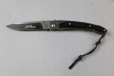 a knife that is laying on a table