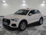 the white audi suv is parked on a checkered tile floor