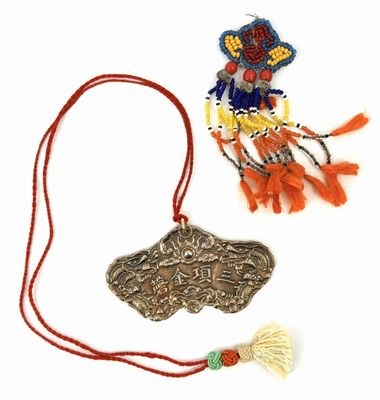 a necklace that has a picture of a person on it