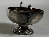 a silver bowl that is sitting on a table