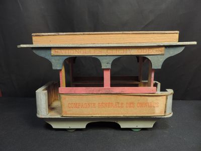an old wooden toy train car with a sign on the front