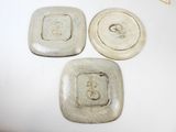 three plates that are sitting on top of a table