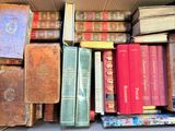 a box full of old books sitting on a table