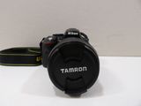 a camera that is sitting on a table with a strap around it