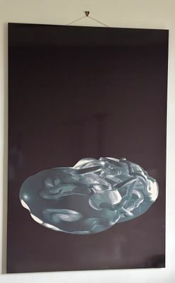 a picture of a painting hanging on the wall above a bed