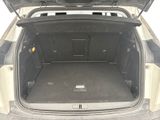 a trunk of a car with the back door open