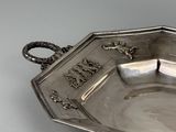 a silver tray that has a handle on it