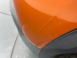 a close up of a car ' s front bumper and fender