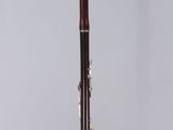 a close up of a clarinet on a stand with a white background