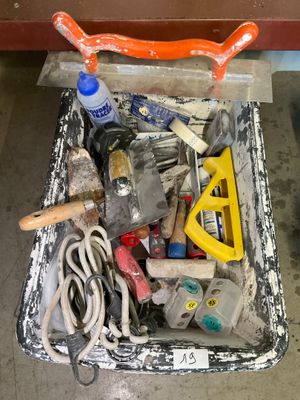 a box full of tools sitting on the floor