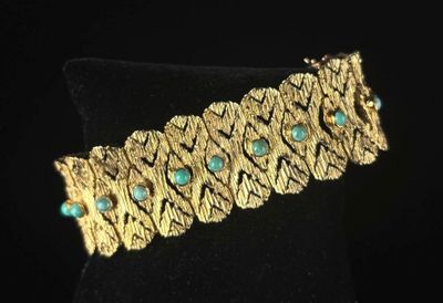 Bracelet articulé en or jaune à maille ouvragée ajourée, orn…