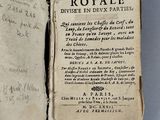an old book with writing on it sitting on top of a table