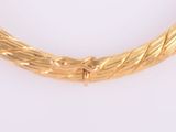 an image of a gold necklace on a white background