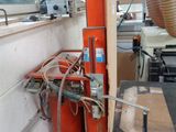 an image of a machine that is working on a piece of wood