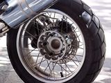 a close up of a motorcycle parked on the side of the street