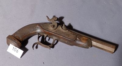an old gun that is on display on the table
