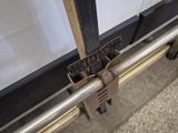 a close up of a metal rail with a ruler attached to it