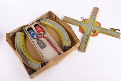 a box with a toy train and a ruler in it