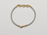 a gold and silver cable bracelet with a clasp
