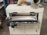 a close up of a machine that is sitting in a warehouse
