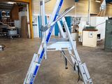 a ladder that is sitting in the middle of a room