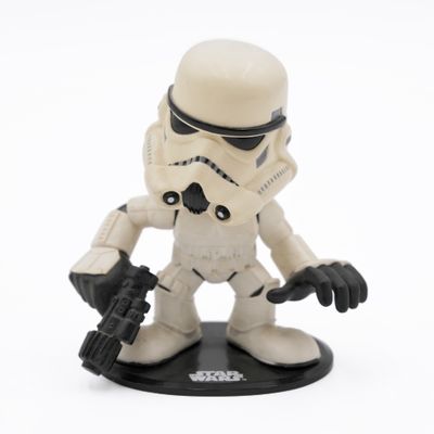 a star wars figurine of a stormtrooper holding a gun