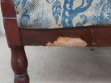 a piece of fabric that has been torn off of the back of a chair