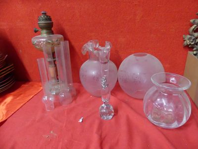 three glass vases sitting on a table with a red cloth