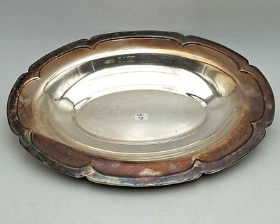 a silver plate that is sitting on a table