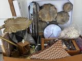 a cardboard box with various items in it on the floor