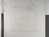 a drawing of a man ' s face on a piece of paper