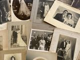 an old photo of a bunch of photos of people on a table