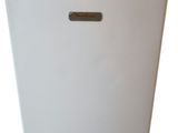 a white trash can with a metal lid on a white background