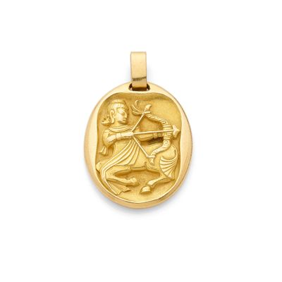 an image of a gold pendant with a man on a horse