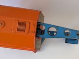 an orange and blue object on a white surface