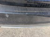 a close up of a car ' s bumper with a hole in it