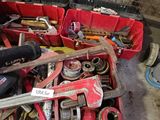 many tools in a red box in a garage