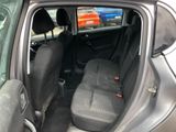 the back seats of a car with a tv in the back of it