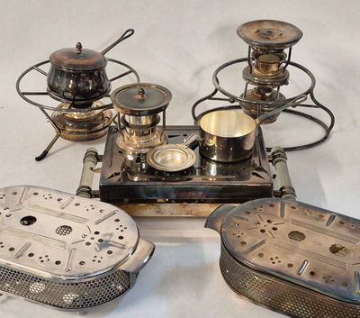 a lot of silver items that are on a table