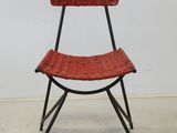 an image of a wicker chair with a basket on the back