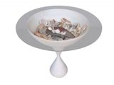 a white bowl with shells in it on a pedestal