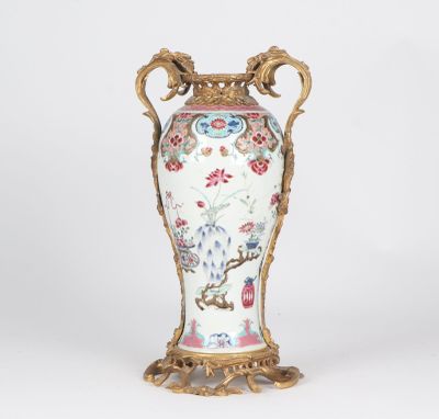 a vase that is sitting on a stand on a white surface